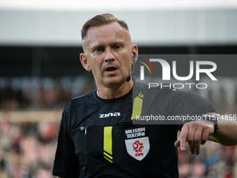 Referee Piotr Lasyk officiates the game between KS Cracovia and Pogon Szczecin in Krakow, Poland, on September 14, 2024. PKO BP Ekstraklasa,...