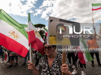 The Association of Iranian Graduates resident in Italy demonstrates on the anniversary of the killing of Mahsa Amini in Iran in Rome, Italy,...