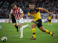 Kamil Grosicki and Jakub Jugas play during the game between KS Cracovia and Pogon Szczecin in Krakow, Poland, on September 14, 2024. PKO BP...