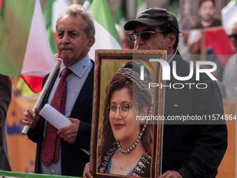 The Association of Iranian Graduates resident in Italy demonstrates on the anniversary of the killing of Mahsa Amini in Iran in Rome, Italy,...