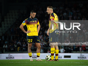 Vahan Bichakhchyan and Kamil Grosicki play during the game between KS Cracovia and Pogon Szczecin in Krakow, Poland, on September 14, 2024....