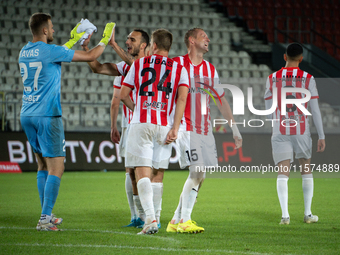 Cracovia players celebrate scoring a goal during the game between KS Cracovia and Pogon Szczecin in Krakow, Poland, on September 14, 2024. P...