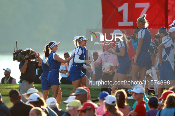 GAINESVILLE, VIRGINIA - SEPTEMBER 14: Emily Kristine Pedersen of Team Europe celebrates with teammates on the 17th green during Fourball Mat...