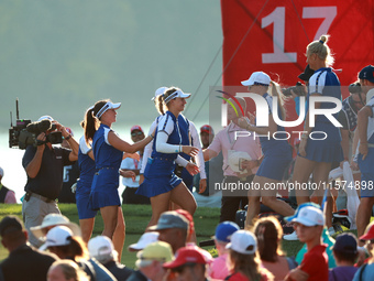 GAINESVILLE, VIRGINIA - SEPTEMBER 14: Emily Kristine Pedersen of Team Europe celebrates with teammates on the 17th green during Fourball Mat...