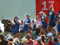 GAINESVILLE, VIRGINIA - SEPTEMBER 14: Emily Kristine Pedersen of Team Europe celebrates with teammates on the 17th green during Fourball Mat...