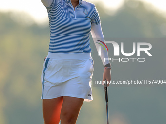 GAINESVILLE, VIRGINIA - SEPTEMBER 14: Allisen Corpuz of the United States reacts to her putt on the 17th green during Day Two of the Solheim...