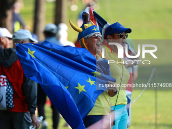 GAINESVILLE, VIRGINIA - SEPTEMBER 14: Fans cheer for Team Europe during Foursomes Matches on Day Two of the Solheim Cup at Robert Trent Jone...