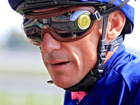 Jockey Frankie Dettori heads to the winner's circle after riding Rhaenys to a win in the third race at Woodbine Racetrack in Toronto, Canada...