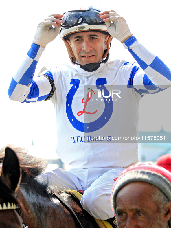 Jockey Rafael Hernandez heads to the winner's circle after riding Whisper Not to a win in the fourth race at Woodbine Racetrack in Toronto,...