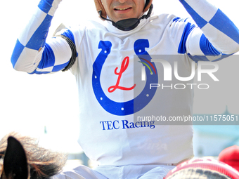 Jockey Rafael Hernandez heads to the winner's circle after riding Whisper Not to a win in the fourth race at Woodbine Racetrack in Toronto,...