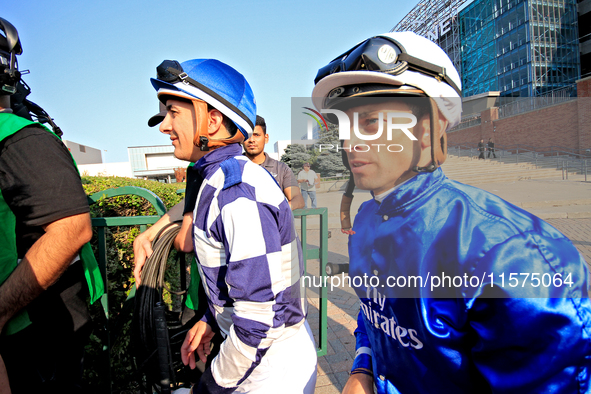 Jockeys Rafael Hernandez, left, and Umberto Rispoli arrive at the walking ring ahead of the bet365 Summer Stakes (Grade I) at Woodbine Racet...