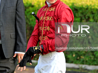 Jockey Oisin Murphy waits for his mount in the walking ring ahead of a win on New Century in the bet365 Summer Stakes (Grade I) at Woodbine...