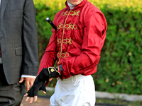 Jockey Oisin Murphy waits for his mount in the walking ring ahead of a win on New Century in the bet365 Summer Stakes (Grade I) at Woodbine...