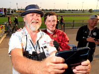 Jockey Oisin Murphy, right, is photographed by a race fan after a win in the bet365 Summer Stakes (Grade I) at Woodbine Racetrack in Toronto...