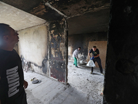 Construction workers restore a multi-storey residential building damaged by Russian shelling in Kharkiv, Ukraine, on September 12, 2024. NO...