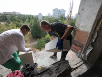 Construction workers restore a multi-storey residential building damaged by Russian shelling in Kharkiv, Ukraine, on September 12, 2024. NO...