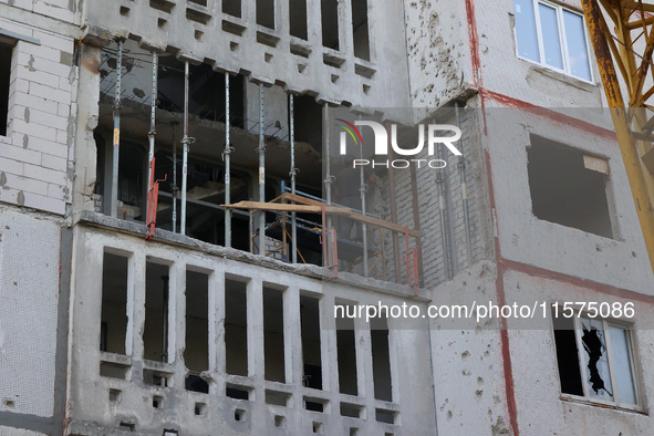 Restoration work is underway in one of the residential buildings damaged by Russian shelling in Kharkiv, Ukraine, on September 12, 2024. 