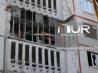 Restoration work is underway in one of the residential buildings damaged by Russian shelling in Kharkiv, Ukraine, on September 12, 2024. (