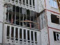 Restoration work is underway in one of the residential buildings damaged by Russian shelling in Kharkiv, Ukraine, on September 12, 2024. (