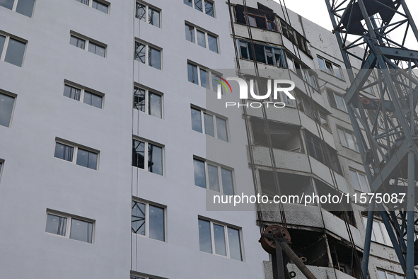 One of the residential buildings damaged by Russian shelling, where reconstruction work is underway, in Kharkiv, Ukraine, on September 12, 2...