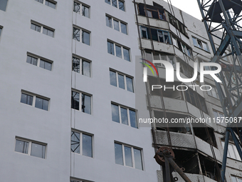 One of the residential buildings damaged by Russian shelling, where reconstruction work is underway, in Kharkiv, Ukraine, on September 12, 2...