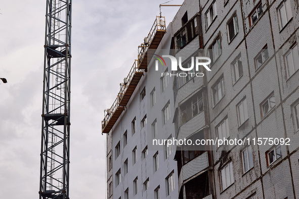 One of the residential buildings damaged by Russian shelling, where reconstruction work is underway, in Kharkiv, Ukraine, on September 12, 2...