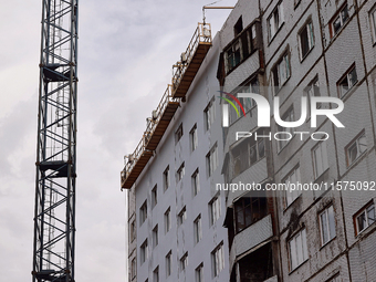 One of the residential buildings damaged by Russian shelling, where reconstruction work is underway, in Kharkiv, Ukraine, on September 12, 2...