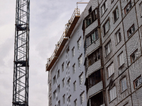 One of the residential buildings damaged by Russian shelling, where reconstruction work is underway, in Kharkiv, Ukraine, on September 12, 2...