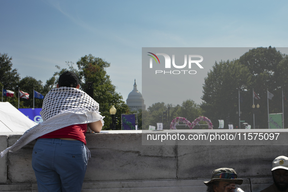 A person wears a Palestinian keffiyeh during the first gender liberation march at Union Station in Washington D.C., USA, on September 14, 20...