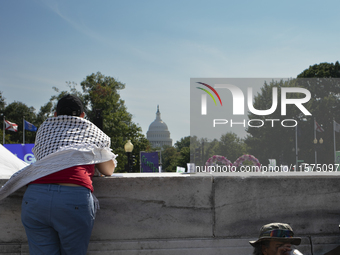 A person wears a Palestinian keffiyeh during the first gender liberation march at Union Station in Washington D.C., USA, on September 14, 20...