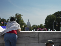 A person wears a Palestinian keffiyeh during the first gender liberation march at Union Station in Washington D.C., USA, on September 14, 20...