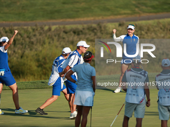 GAINESVILLE, VIRGINIA - SEPTEMBER 14: Emily Kristine Pedersen of Team Europe reats to her putt on the 15th green during Fourball Matches on...