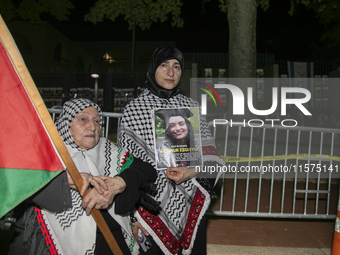 A person holds an image of Turkish-American human rights activist Aysenur Ezgi Eygi during a pro-Palestinian rally in front of the Israeli E...