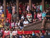 Revelers watch the sacred pole Ya:shi erection procession at Kathmandu Durbar Square in Kathmandu, Nepal, on September 15, 2024, ahead of th...