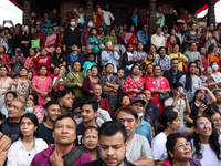 Revelers watch the sacred pole Ya:shi erection procession at Kathmandu Durbar Square in Kathmandu, Nepal, on September 15, 2024, ahead of th...