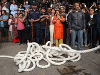 Revelers watch the sacred pole Ya:shi erection procession at Kathmandu Durbar Square in Kathmandu, Nepal, on September 15, 2024, ahead of th...