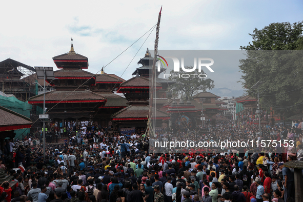 Nepali Hindu devotees erect a sacred pole locally called ''Ya:Shi,'' marking the formal start of Indra Jatra, a fair dedicated to the Hindu...