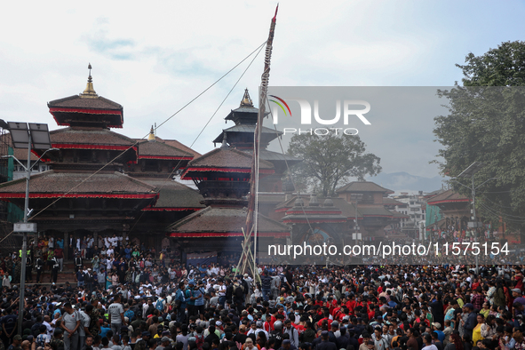 Nepali Hindu devotees erect a sacred pole locally called ''Ya:Shi,'' marking the formal start of Indra Jatra, a fair dedicated to the Hindu...