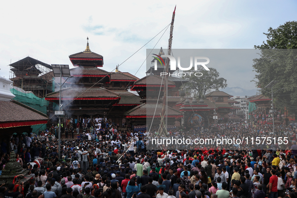 Nepali Hindu devotees erect a sacred pole locally called ''Ya:Shi,'' marking the formal start of Indra Jatra, a fair dedicated to the Hindu...