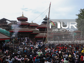 Nepali Hindu devotees erect a sacred pole locally called ''Ya:Shi,'' marking the formal start of Indra Jatra, a fair dedicated to the Hindu...