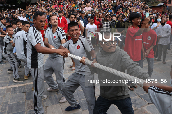 Nepali Hindu devotees pull the sacred pole locally called ''Ya:Shi,'' marking the formal start of Indra Jatra, a fair dedicated to the Hindu...