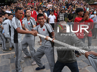 Nepali Hindu devotees pull the sacred pole locally called ''Ya:Shi,'' marking the formal start of Indra Jatra, a fair dedicated to the Hindu...