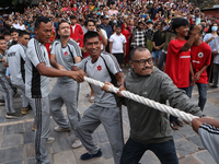 Nepali Hindu devotees pull the sacred pole locally called ''Ya:Shi,'' marking the formal start of Indra Jatra, a fair dedicated to the Hindu...