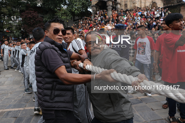 Nepali Hindu devotees pull the sacred pole locally called ''Ya:Shi,'' marking the formal start of Indra Jatra, a fair dedicated to the Hindu...