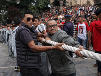 Nepali Hindu devotees pull the sacred pole locally called ''Ya:Shi,'' marking the formal start of Indra Jatra, a fair dedicated to the Hindu...