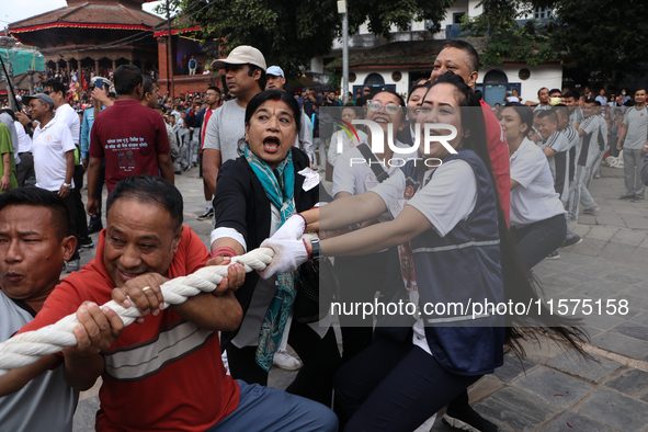 Nepali Hindu devotees pull the sacred pole locally called ''Ya:Shi,'' marking the formal start of Indra Jatra, a fair dedicated to the Hindu...