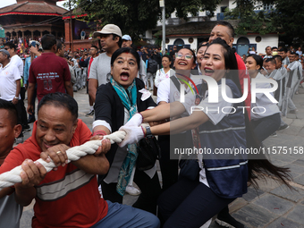 Nepali Hindu devotees pull the sacred pole locally called ''Ya:Shi,'' marking the formal start of Indra Jatra, a fair dedicated to the Hindu...