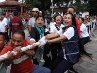 Nepali Hindu devotees pull the sacred pole locally called ''Ya:Shi,'' marking the formal start of Indra Jatra, a fair dedicated to the Hindu...