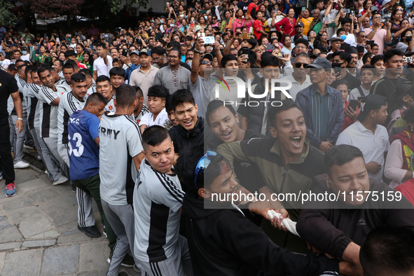 Nepali Hindu devotees pull the sacred pole locally called ''Ya:Shi,'' marking the formal start of Indra Jatra, a fair dedicated to the Hindu...