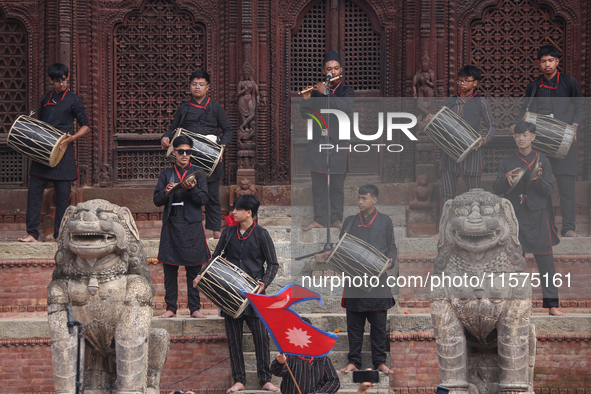 A Nepali musical band dons Newari attire and plays traditional musical instruments during the sacred pole Ya:shi erection procession at Kath...